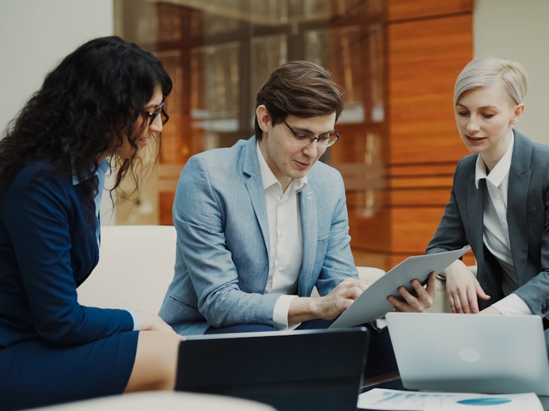 Corporate finance team reviewing payroll documentation