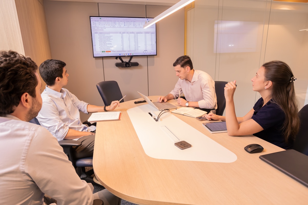 Professional onboarding meeting with paperwork and documentation
